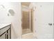 Bathroom features a glass shower stall, vanity, and tile flooring at 9001 Lanark Ln, Indian Land, SC 29707