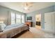 Bright bedroom offers en suite bath with walk-in shower and plenty of natural light at 9001 Lanark Ln, Indian Land, SC 29707