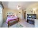 Bright bedroom with a whimsical theme, featuring a ceiling fan, a cozy bed, and ample space for play at 9001 Lanark Ln, Indian Land, SC 29707