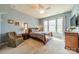 Relaxing bedroom with natural light, ceiling fan and neutral color scheme at 9001 Lanark Ln, Indian Land, SC 29707