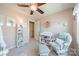 Charming Bedroom with a rocking chair, ceiling fan, and soft colors, creating a peaceful space for relaxation at 9001 Lanark Ln, Indian Land, SC 29707
