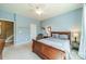 Spacious bedroom with cozy chair, offering natural light and neutral color scheme at 9001 Lanark Ln, Indian Land, SC 29707