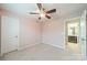 Bedroom featuring plush carpet, ceiling fan, and a private bathroom at 9001 Lanark Ln, Indian Land, SC 29707