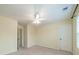 Bright bedroom features neutral carpet, walls, ceiling fan and a window at 9001 Lanark Ln, Indian Land, SC 29707