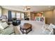 Spacious bonus room with large windows, ceiling fan, and comfortable seating area, perfect for relaxation and entertainment at 9001 Lanark Ln, Indian Land, SC 29707