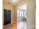 Inviting foyer with hardwood floors and a view of the dining area, showcasing the home's open layout at 9001 Lanark Ln, Indian Land, SC 29707