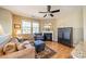 Cozy living room with a fireplace, comfortable seating, and hardwood floors, perfect for relaxation at 9001 Lanark Ln, Indian Land, SC 29707