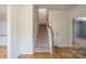 Staircase with carpet steps and wooden handrail, leading to the upper level of the home at 9001 Lanark Ln, Indian Land, SC 29707