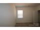 Cozy bedroom with carpet, features a window bringing in natural light at 919 Mankey Dr, Huntersville, NC 28078