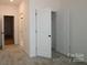 Spacious carpeted bedroom with multiple access to additional rooms at 919 Mankey Dr, Huntersville, NC 28078