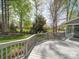 Spacious back deck offering views of the home's well-manicured lawn and mature trees at 940 Brittany Ct # 23, Gastonia, NC 28056