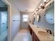 This bathroom features a double sink vanity, stylish light fixtures, and a hexagon-tile floor at 940 Brittany Ct # 23, Gastonia, NC 28056