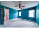 Well-lit bedroom with a ceiling fan, complemented by natural light from the two windows at 940 Brittany Ct # 23, Gastonia, NC 28056