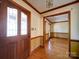 Elegant foyer showcasing hardwood floors, stained trim and a decorative glass front door at 940 Brittany Ct # 23, Gastonia, NC 28056