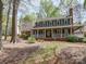 Charming two-story home featuring a welcoming front porch and beautiful landscaping at 940 Brittany Ct # 23, Gastonia, NC 28056