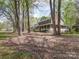 Lovely home with a spacious front porch and beautiful, mature trees surrounding the property at 940 Brittany Ct # 23, Gastonia, NC 28056