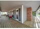 Expansive front porch with a brick chimney and plenty of room for outdoor furniture at 940 Brittany Ct # 23, Gastonia, NC 28056