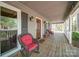 Inviting front porch with rocking chairs, providing a warm welcome to guests at 940 Brittany Ct # 23, Gastonia, NC 28056