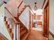 Beautiful stairway featuring hardwood steps, white risers, and access to kitchen and upper floors at 940 Brittany Ct # 23, Gastonia, NC 28056