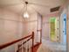 Upstairs hallway with carpeted floors and trim, and access to bedrooms and bathrooms at 940 Brittany Ct # 23, Gastonia, NC 28056