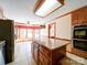 Kitchen with island seating, stainless-steel appliances, granite countertops, and breakfast nook overlooking backyard at 940 Brittany Ct # 23, Gastonia, NC 28056