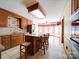 Traditional kitchen with island, wood cabinets, granite counters, stainless appliances, breakfast area and tiled floors at 940 Brittany Ct # 23, Gastonia, NC 28056