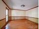 Spacious room with hardwood floors, paneled trim, neutral paint, and lots of natural light at 940 Brittany Ct # 23, Gastonia, NC 28056
