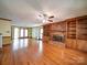 Spacious living room with hardwood floors, a cozy brick fireplace, and ample natural light at 940 Brittany Ct # 23, Gastonia, NC 28056