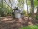 Well-maintained storage shed in a backyard with mature trees at 940 Brittany Ct # 23, Gastonia, NC 28056