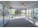 Light-filled sunroom with large windows providing panoramic views of the surrounding landscape at 940 Brittany Ct # 23, Gastonia, NC 28056