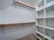 Walk-in closet with shelves and hanging rods provides ample storage space at 940 Brittany Ct # 23, Gastonia, NC 28056