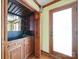Convenient wet bar area with a sink, cabinetry, mirrored backsplash and easy backyard access at 940 Brittany Ct # 23, Gastonia, NC 28056
