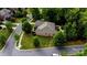 Brick single Gathering home with a lush lawn, mature trees, and a beautifully paved road at 9506 Minnie Lemmond Ln # 170, Mint Hill, NC 28227