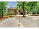 Expansive brick home backyard with trees and a shed, offering a serene outdoor setting at 9506 Minnie Lemmond Ln # 170, Mint Hill, NC 28227