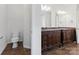 Elegant bathroom featuring a granite-topped double vanity at 9506 Minnie Lemmond Ln # 170, Mint Hill, NC 28227