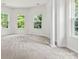 Bright bonus room with carpet, columns and windows with a view at 9506 Minnie Lemmond Ln # 170, Mint Hill, NC 28227