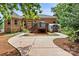 Brick home's backyard features a deck with stairs, a shed, a walkway, and landscaping at 9506 Minnie Lemmond Ln # 170, Mint Hill, NC 28227