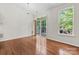 Bright bedroom with wood floors, sliding door to deck, and lots of light from large windows at 9506 Minnie Lemmond Ln # 170, Mint Hill, NC 28227