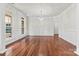 Elegant dining room with hardwood floors, wainscoting, and a crystal chandelier at 9506 Minnie Lemmond Ln # 170, Mint Hill, NC 28227