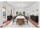 Bright dining room features a modern chandelier, elegant furnishings and beautiful hardwood flooring at 9506 Minnie Lemmond Ln # 170, Mint Hill, NC 28227