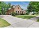 Spacious home with a long driveway, a well-maintained lawn, and lush green landscaping at 9506 Minnie Lemmond Ln # 170, Mint Hill, NC 28227