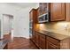 Kitchen features custom cabinets, granite countertops, and stainless steel appliances at 9506 Minnie Lemmond Ln # 170, Mint Hill, NC 28227