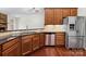 Updated kitchen features stainless steel appliances, granite counters and wood cabinets at 9506 Minnie Lemmond Ln # 170, Mint Hill, NC 28227