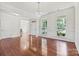 Formal living room featuring hardwood floors, wainscoting, and a crystal chandelier at 9506 Minnie Lemmond Ln # 170, Mint Hill, NC 28227