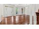Open concept living room with hardwood floors, ample light, and traditional architectural detail at 9506 Minnie Lemmond Ln # 170, Mint Hill, NC 28227