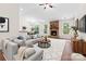 Spacious living room boasts a modern fireplace, hardwood flooring, and a comfortable sectional sofa at 9506 Minnie Lemmond Ln # 170, Mint Hill, NC 28227