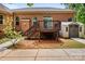 Brick home's backyard features a deck with stairs, small shed, walkway, and well-maintained landscaping at 9506 Minnie Lemmond Ln # 170, Mint Hill, NC 28227