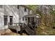 A back deck with outdoor seating and a screened-in porch at 9820 Janeiro Dr, Huntersville, NC 28078