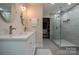 Bathroom features double sinks, marble countertops, and a glass enclosed shower at 9820 Janeiro Dr, Huntersville, NC 28078