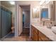 Well-lit bathroom with wood-look flooring, bright countertops, and neutral walls at 9820 Janeiro Dr, Huntersville, NC 28078